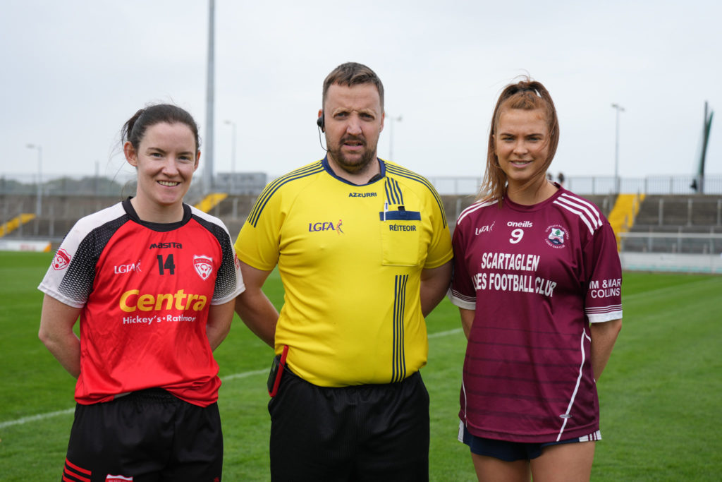 Rathmore LGFA captain Caroline Reen and Scartaglin LGFA captain Aoife Dunlea with referee Maurice Murphy ahead of the Bons Secours Ladies Intermediate Football Championship Final | Photo by David Corkey Radio Kerry Sport
